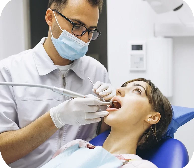 a doctor performing dental checkup to a patient with tooth ache, doctor using advanced technology for the treatment