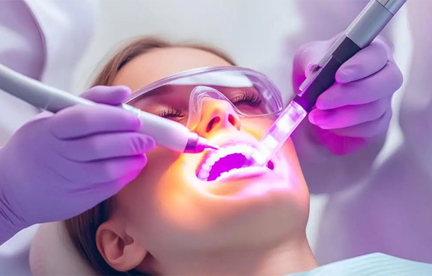 Laser dental therapy treating gum infection at Scientific Dental Clinic Kochi Kerala using advanced dental laser technology